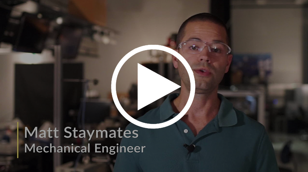 Screenshot of video shows a researcher wearing safety glasses with text: Matt Staymates, Mechanical Engineer