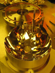 Gold-plated bowl-shaped device is JILA's ion trap for measuring EDM.