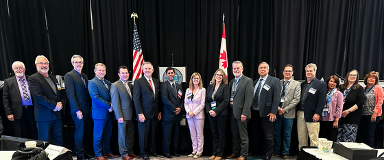 NCWM Board of Directors and staff together with NIST representatives after the MOU signing at the NCWM Annual Meeting (August 1, 2023).