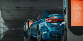 car at electric charging station