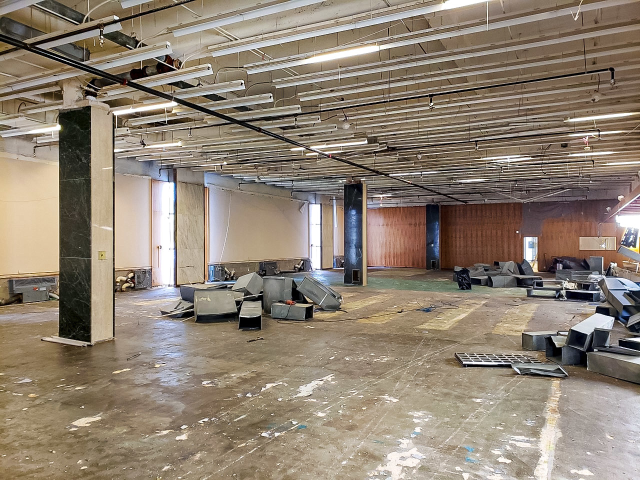 Photo of asbestos abatement of 1st floor and mezzanine of NLM Building 38. Open ceiling is shown.