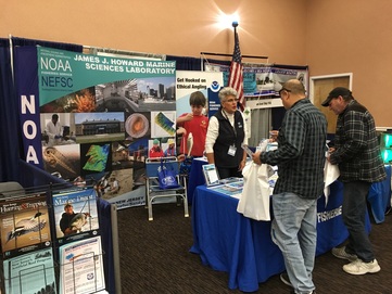 NOAA Fisheries outreach booth at fishing show