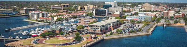 Aerial view of Pensacola's Palafox Pier with a harbor and downtown in the background. Credit City of Pensacola