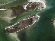 Aerial image of two islands off the Gulf coast of Alabama.