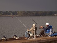 Two men fishing and chatting at Great Marsh Park in Cambridge, Maryland.