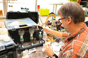 Biological science technician Mark Dixon filters water samples during a biodeposition experiment.