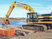 Heavy construction equipment used during a dam removal.