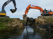 construction equipment being used to replace a culvert