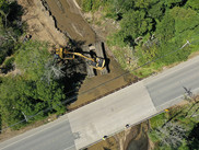 Aerial photo of construction equipment in a streambed