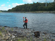Scientist measuring channel dimensions of the lower Penobscot River. Photo courtesy of the U.S. Geological Survey
