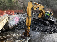 Construction equipment removing the Horseshoe Mill Dam on the Weweantic River.