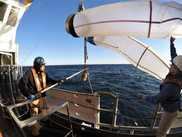 Deck hands Lindsey Houska (right) and Aaron Walton retrieving the plankton bongo nets NOAA Fisheries