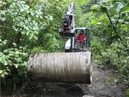 Removal of a culvert that was blocking fish passage in Mink Creek, Alaska.