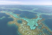 Aerial view of reticulated coral reefs referred at Manawai (Pearl and Hermes Atoll), a high-density marine debris accumulation hotspot. 