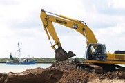 Construction equipment digging a channel. 