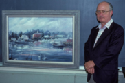 Dr. James Hanks with a painting of Milford Harbor presented by laboratory staff upon his retirement 1985. Credit: NOAA Fisheries