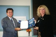 Claire Steimle (right) receives a 30+ years of service recognition certificate from Scott B. Gudes, NOAA /Acting Administrator. NOAA Fisheries
