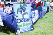 The welcome table at the entrance of Ocean Fun Days. Here you can get information on event day maps, scavenger hunt, and more! NOAA Fisheries