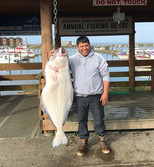 Angler holding a Pacific halibut