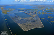 Half-formed marsh islands fade in from open water, as seen from the sky