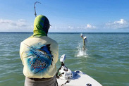 Fisherman reels up a tarpon