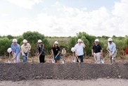 A group of seven people in white hardhats hold shovels at a groundbreaking ceremony. Credit: Coastal Protection and Restoration Authority
