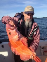 Captain Jay Field with a large adult yelloweye rockfish.