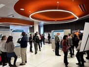 People at a meeting poster session