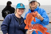 Janet Coit and Melissa Monk with Vermilion rockfish on a survey.