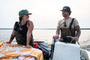 Stephanie and Julien Swanson, sibling oyster farmers on their boat. Credit: Christine Hochkeppel