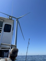 wind turbine with recreational fishing boat