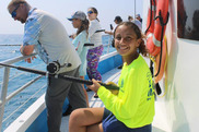 kid fishing on a headboat