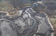 Aerial view of the empty reservoirs that once held water behind major dams on the Klamath River. Credit: Bob Pagliuco, NOAA Fisheries.
