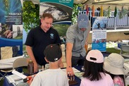 David Farrell (left) and Jonas Veazey engage in community outreach at the Oroville Salmon Festival. Credit: NOAA.