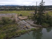 Aerial view of heavy machinery along a river. Credit: WDFW.