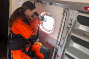 Katherine McKenna photographs right whales out the NOAA Twin Otter aircraft window