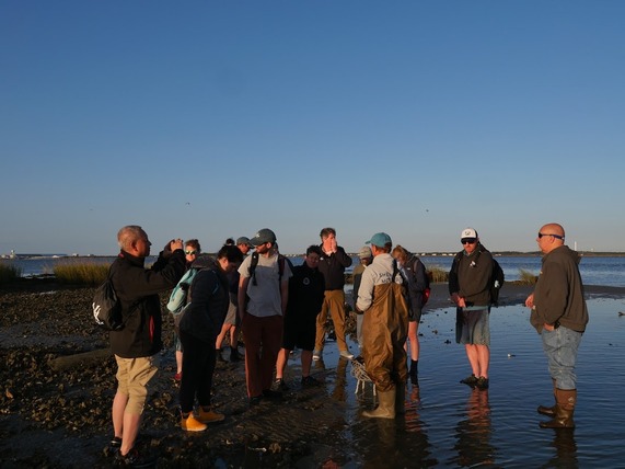 Members of the Sea Grant Aquaculture Leadership Academy tour an oyster and salt marsh restoration site.