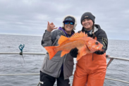 California Collaborative Fisheries Research Program Statewide Coordinator Erin J. (right), holds a canary rockfish.