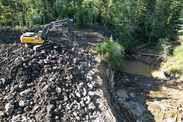 An excavator places stones at the site of the demolished dam. Credit: Cowlitz Indian Tribe