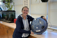 Teacher at Sea Tonya Prentice and the recovered drifter at Tremont Consolidated School in Bass Harbor, Maine.