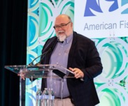 Dr. Jason Link at podium crop