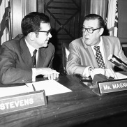 U.S. Senators Ted Stevens (R-AK) and Warren Magnuson (D-WA) having a conversation.