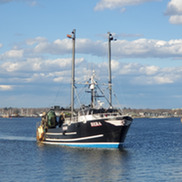 A commercial fishing vessel at sea.