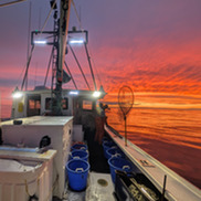 Fishing vessel at sunset