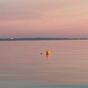 Orange pop up buoy at sea 