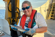 Teacher at Sea Krista Fleming holding Cuban dogfish shark