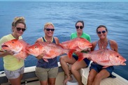 Ladies with Red Snapper credit Grayson Shepard