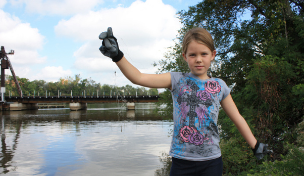 Girl holding up recovered fishing line.