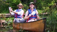  teachers at NOAA's estuary workshop in a canoe on a lake