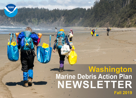 Two volunteers at a Washington coastal beach clean up.